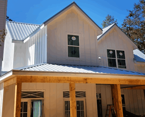 New Build Showcasing Metal Roof and Vertical Siding