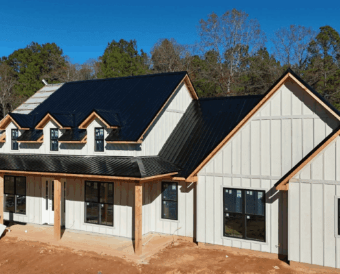 Elegant Elevated Home Construction Nearing Completion with Fireplace Finishing Touches